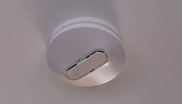A photo of a smoke detector installed on a ceiling in Perth.