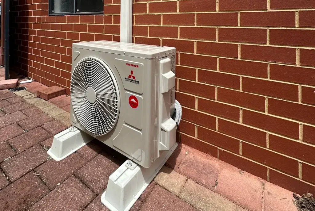 A photo of a split system air conditioner installed outside of a home in Perth.